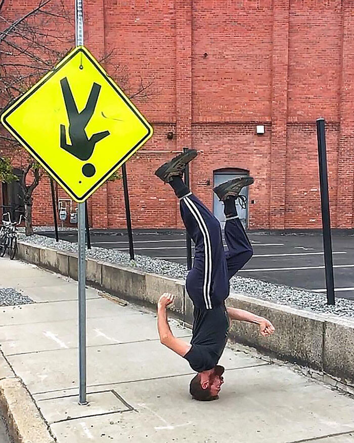 OMG!! Upside down sign and man